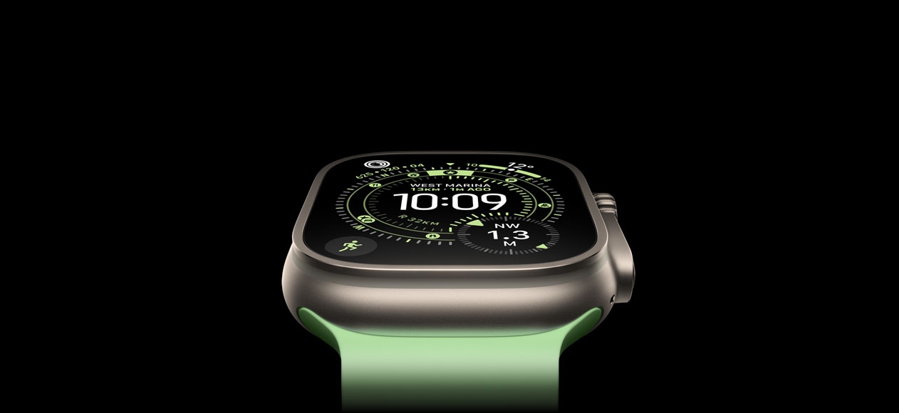 Apple Watch Ultra 3, natural titanium case, compass on Orienteering watch face, neon green Ocean Band