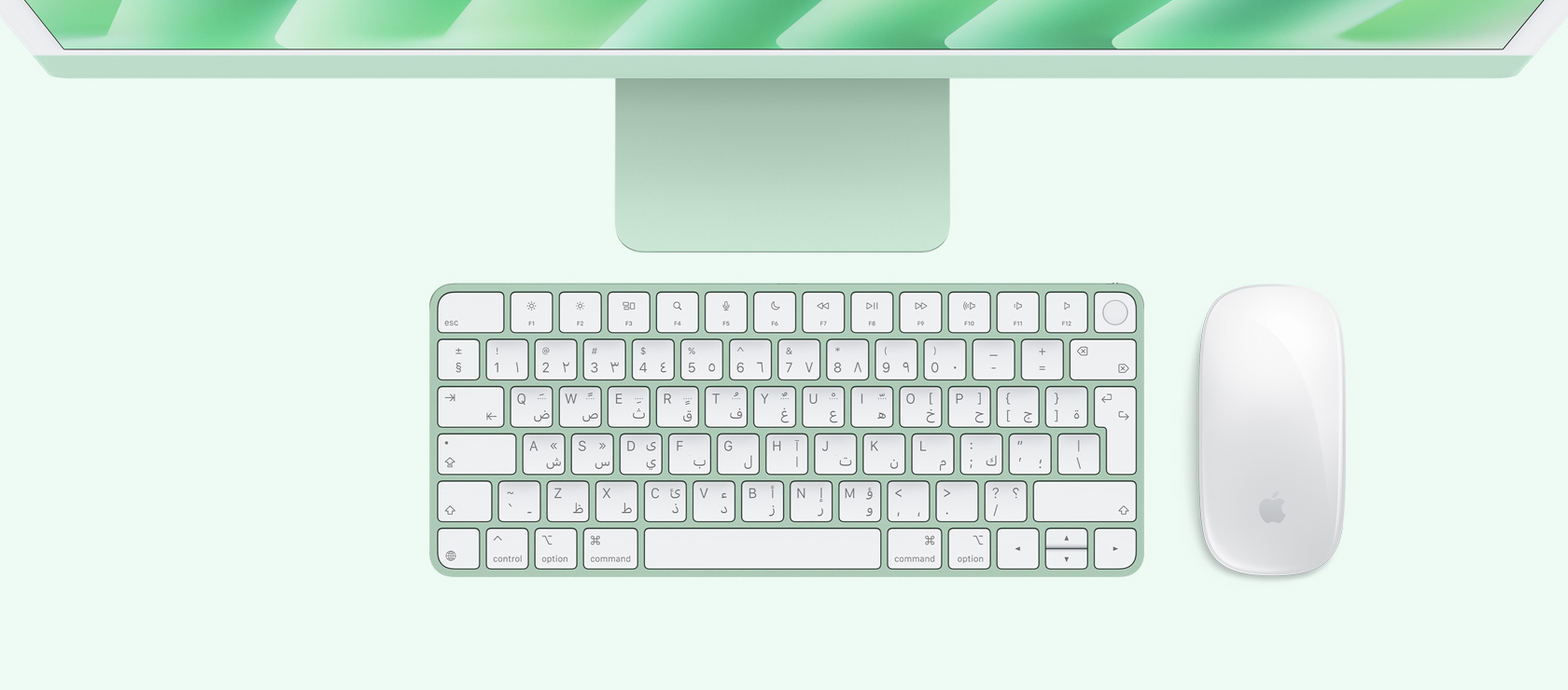 لقطة علوية لجهاز iMac باللون الأخضر مع ماوس ولوحة مفاتيح بلون يطابق لون الجهاز